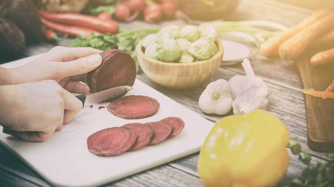 Cutting Beetroot on Chopping Board